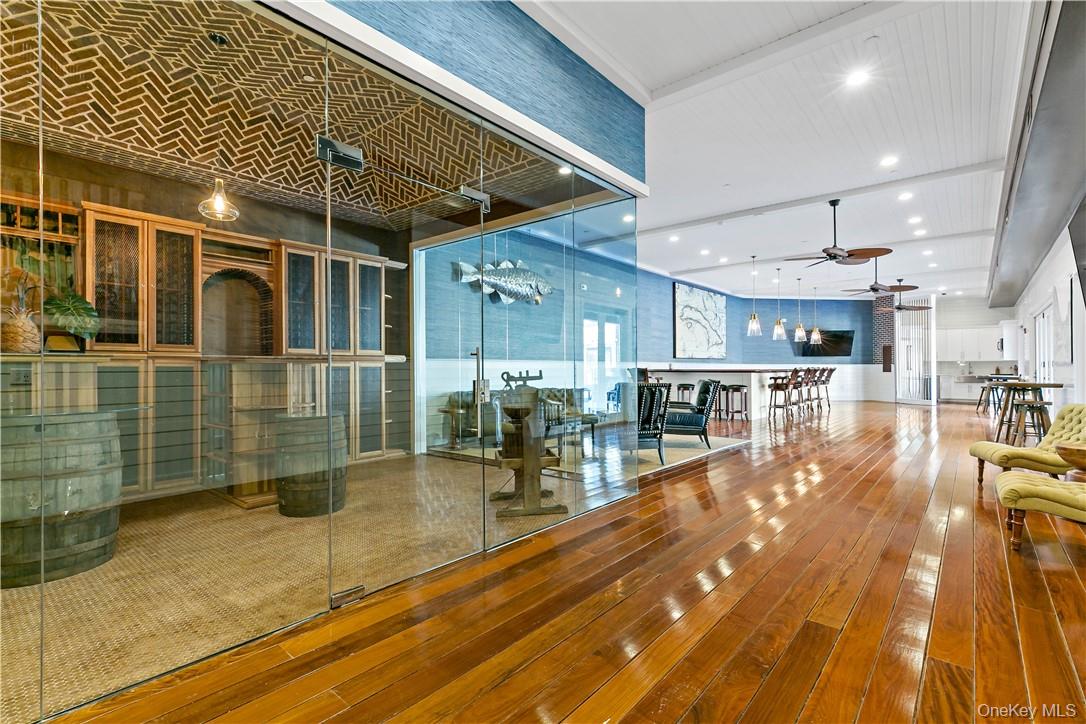 45 Hudson View Way Tarrytown, NY 10591 - Photo 24 of 26 a view of a patio with table and chairs with wooden floor and fence