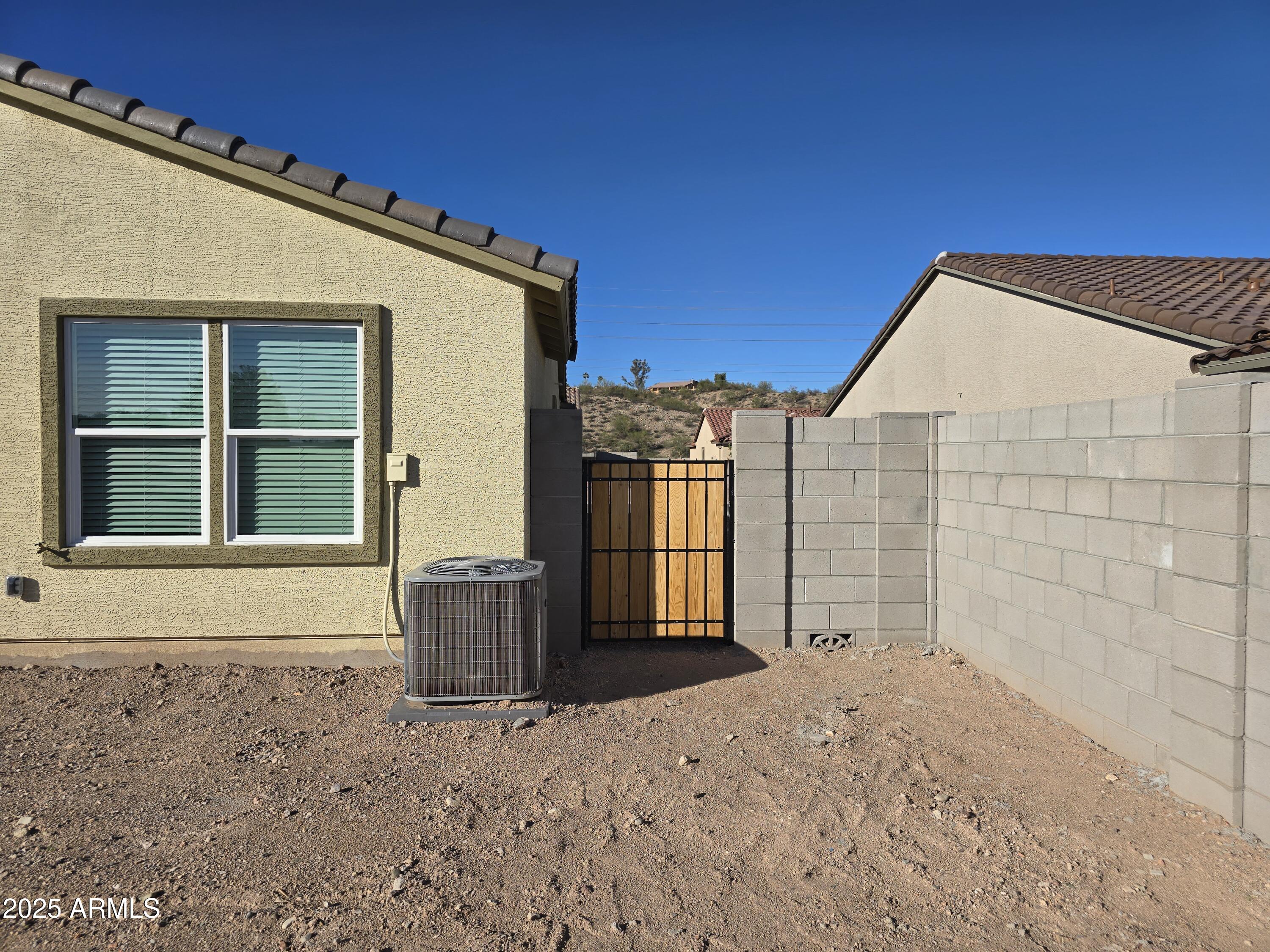 729 Dylan Court Wickenburg, AZ 85390 - Photo 14 of 14 a view of a house with a backyard