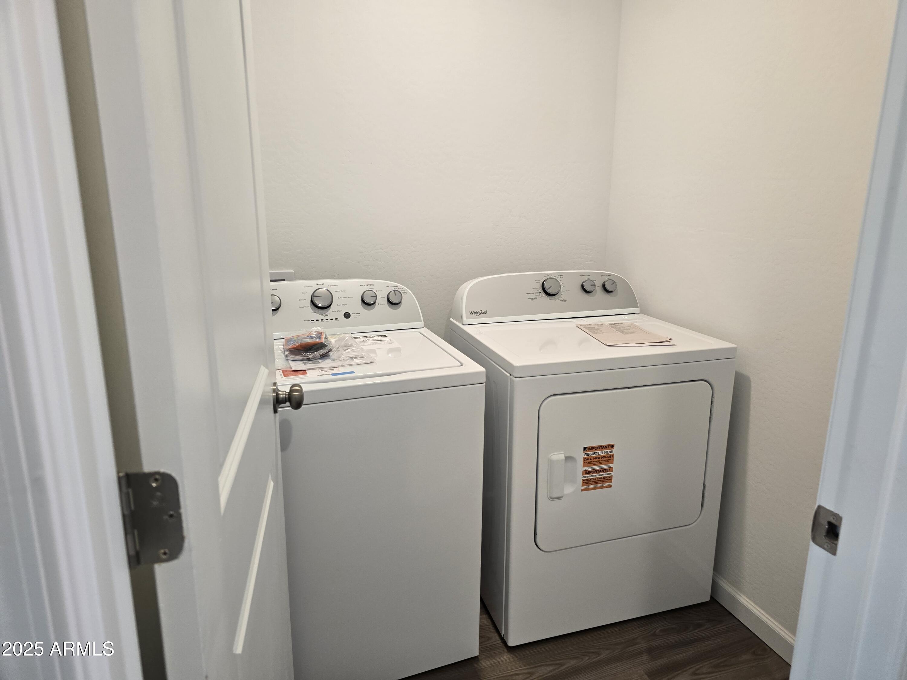 729 Dylan Court Wickenburg, AZ 85390 - Photo 6 of 14 a utility room with dryer and washer