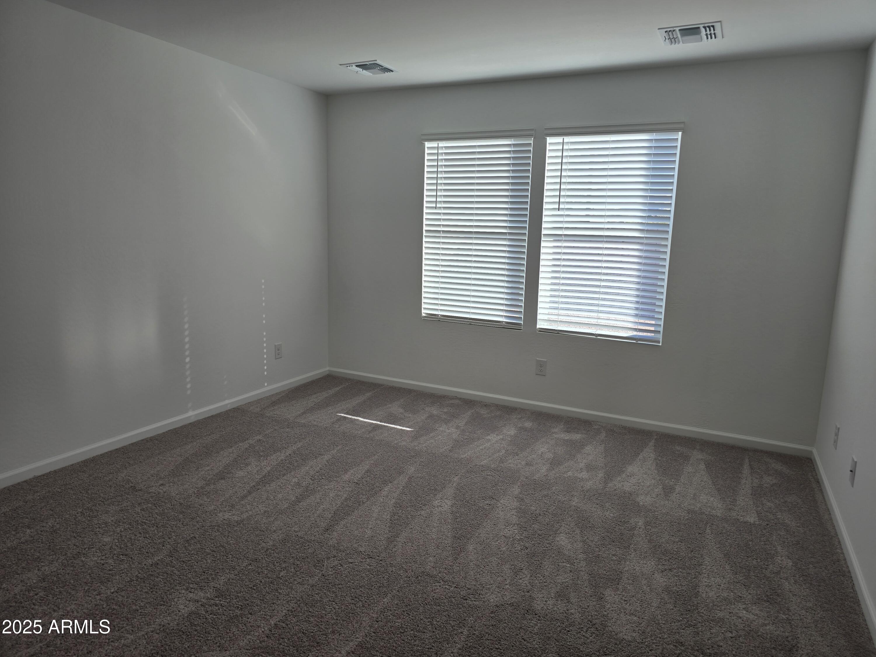 729 Dylan Court Wickenburg, AZ 85390 - Photo 9 of 14 a view of an empty room with a window