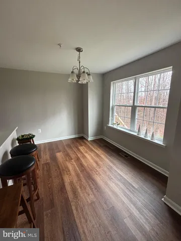 a bed room with a bed and a ceiling fan