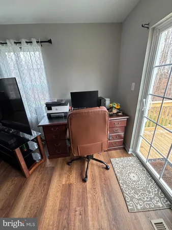 a workspace with furniture and a window