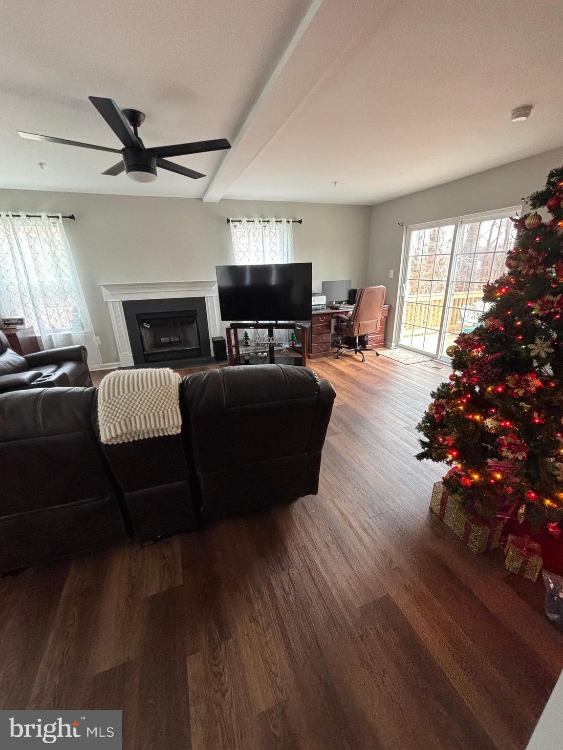 101 Anchor Lane Lusby, MD 20657 - Photo 20 of 45 a living room with furniture fireplace and flat screen tv