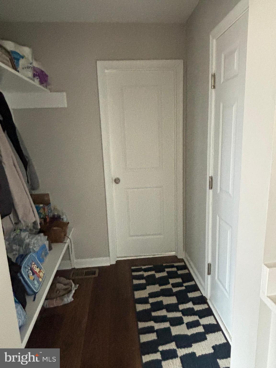 101 Anchor Lane Lusby, MD 20657 - Photo 22 of 45 a walk in closet with wooden floor