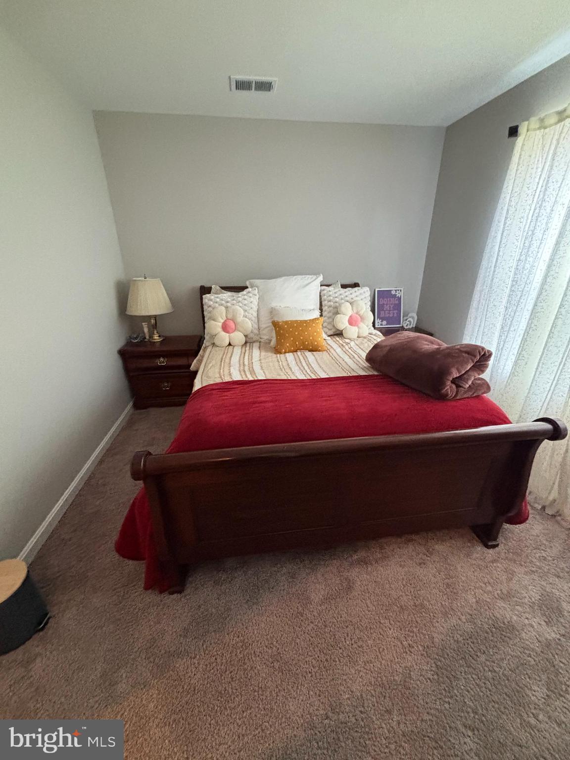 101 Anchor Lane Lusby, MD 20657 - Photo 32 of 45 a bed sitting in a bedroom next to a window