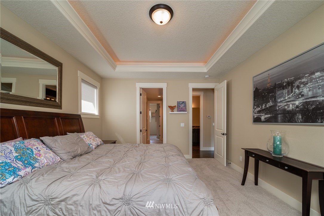 17409 Northeast 30th Court Ridgefield, WA 98642 - Photo 22 of 32 a bedroom with a bed and a desk