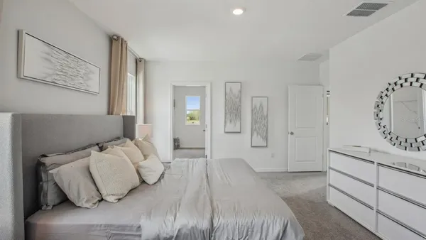 a bedroom with a bed and with furniture