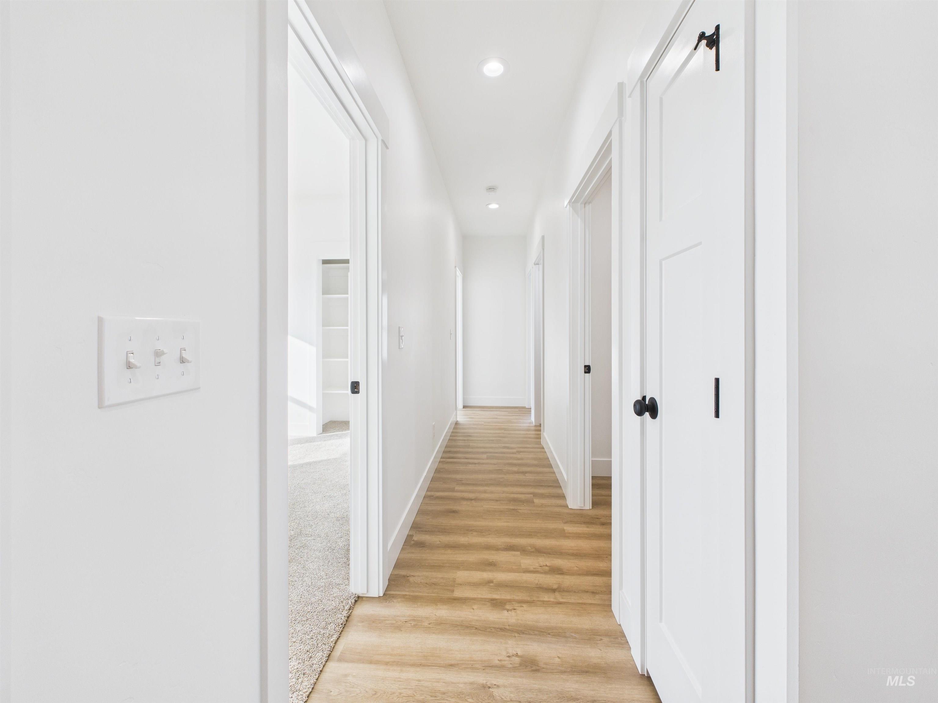 1216 Bronze Drive Rupert, ID 83350 - Photo 19 of 28 Hall with light wood-style flooring and recessed lighting