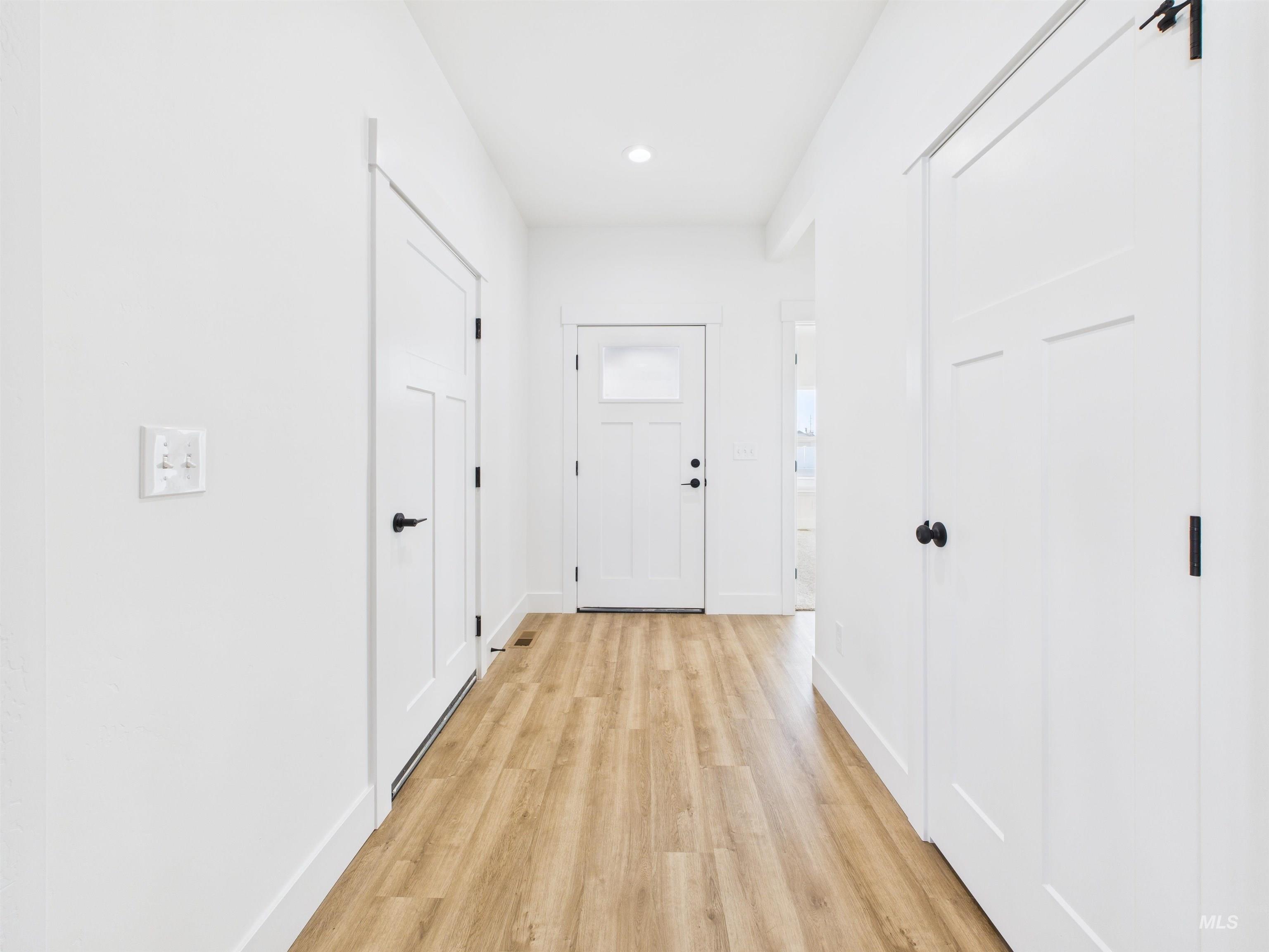 1216 Bronze Drive Rupert, ID 83350 - Photo 2 of 28 Corridor with light wood-style floors and recessed lighting