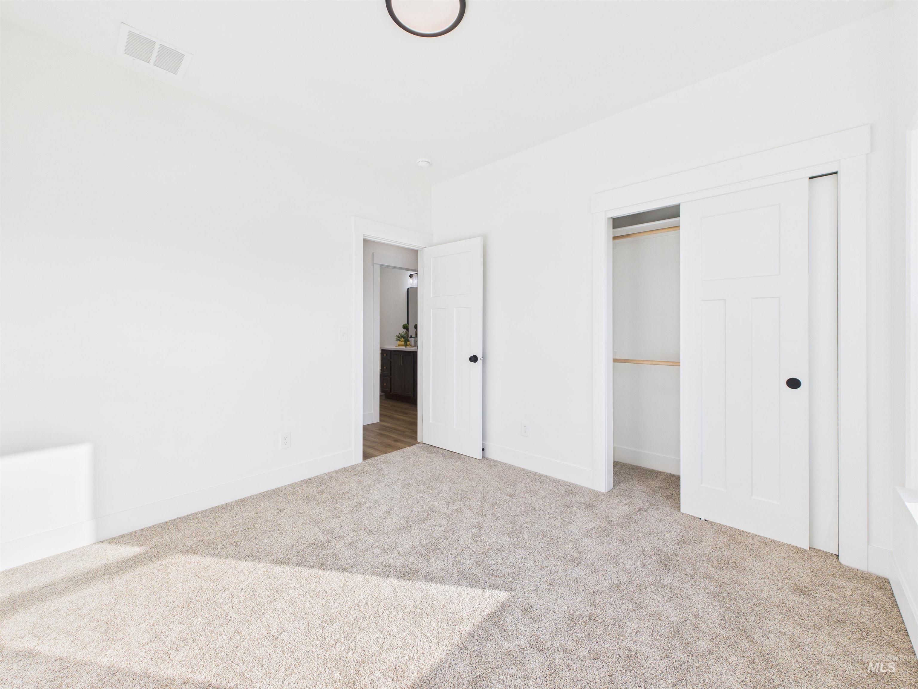 1216 Bronze Drive Rupert, ID 83350 - Photo 23 of 28 Unfurnished bedroom with a closet and light carpet