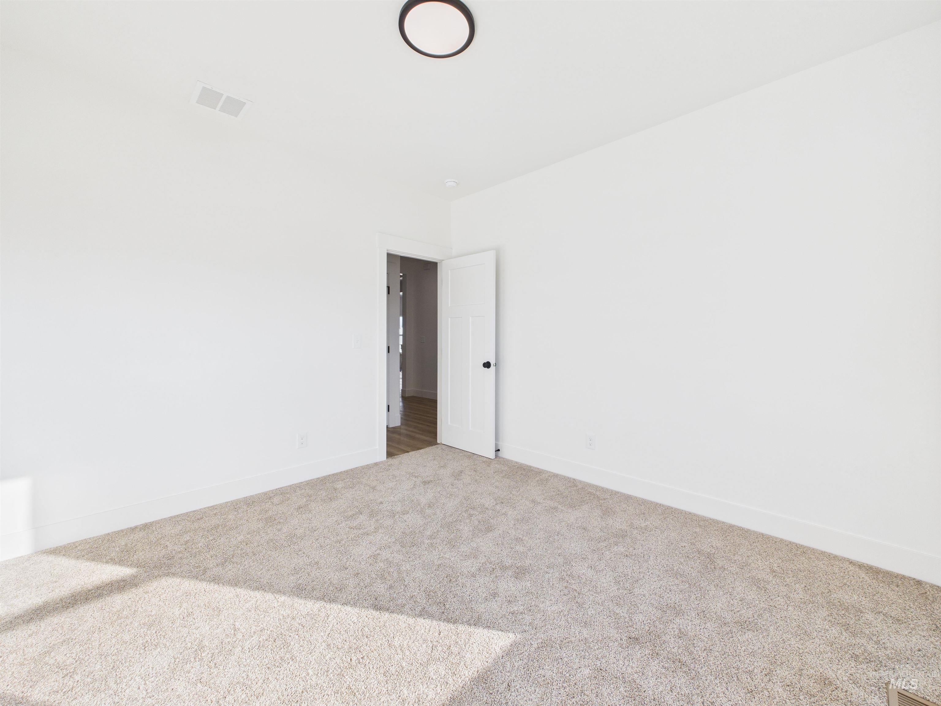 1216 Bronze Drive Rupert, ID 83350 - Photo 25 of 28 Empty room with carpet floors and baseboards