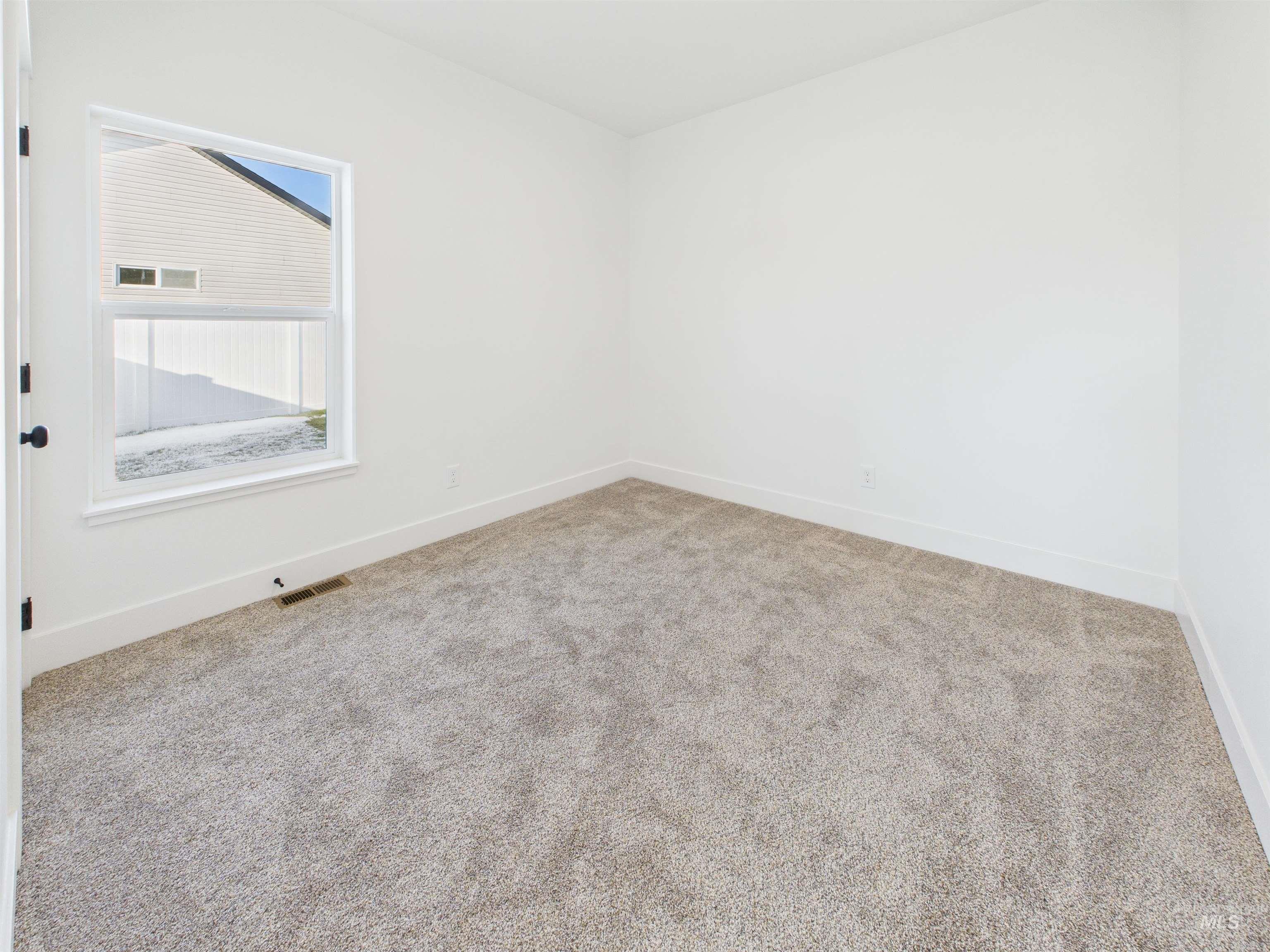 1216 Bronze Drive Rupert, ID 83350 - Photo 27 of 28 Carpeted spare room featuring baseboards