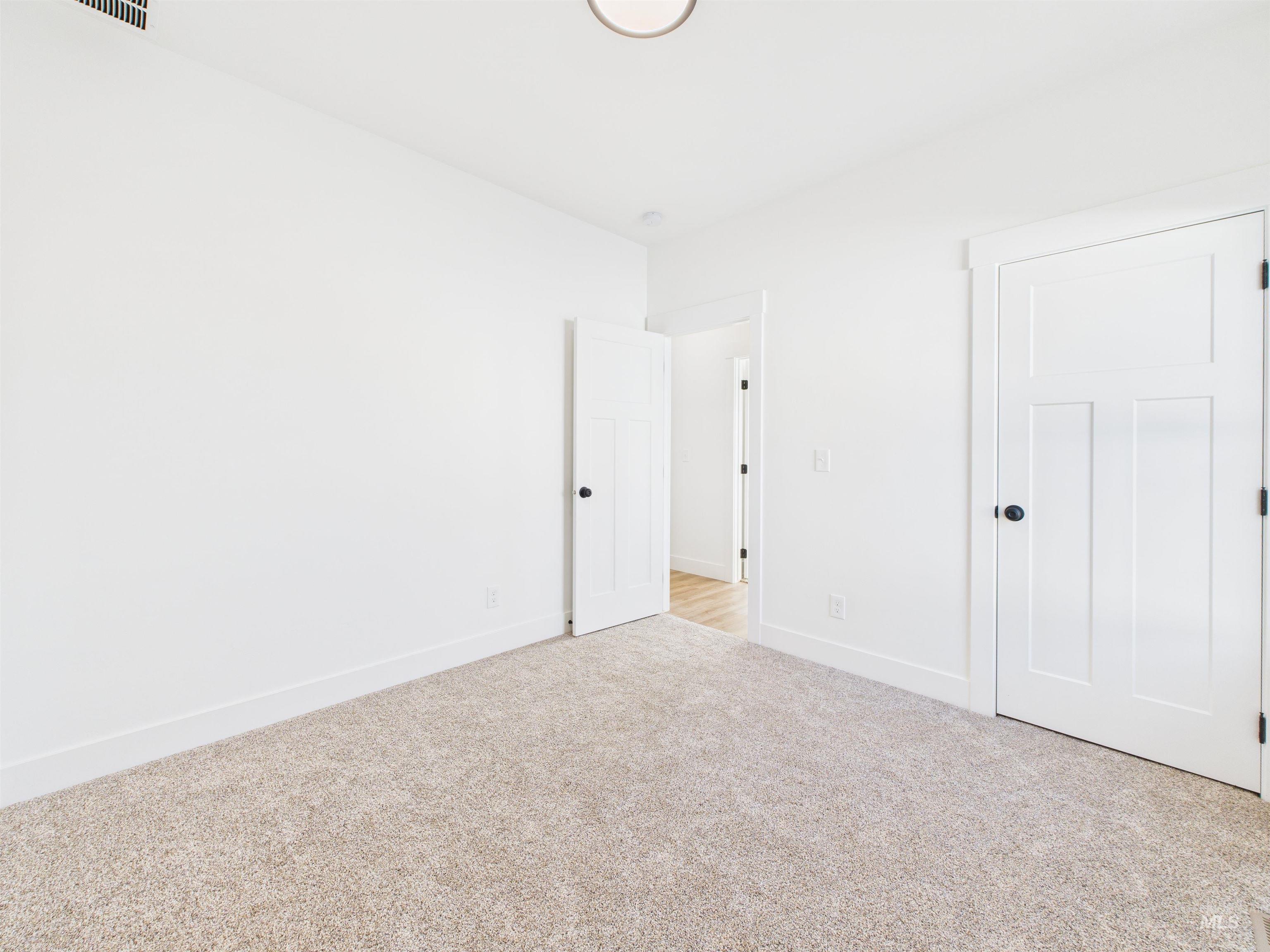 1216 Bronze Drive Rupert, ID 83350 - Photo 28 of 28 Unfurnished bedroom with light carpet and baseboards