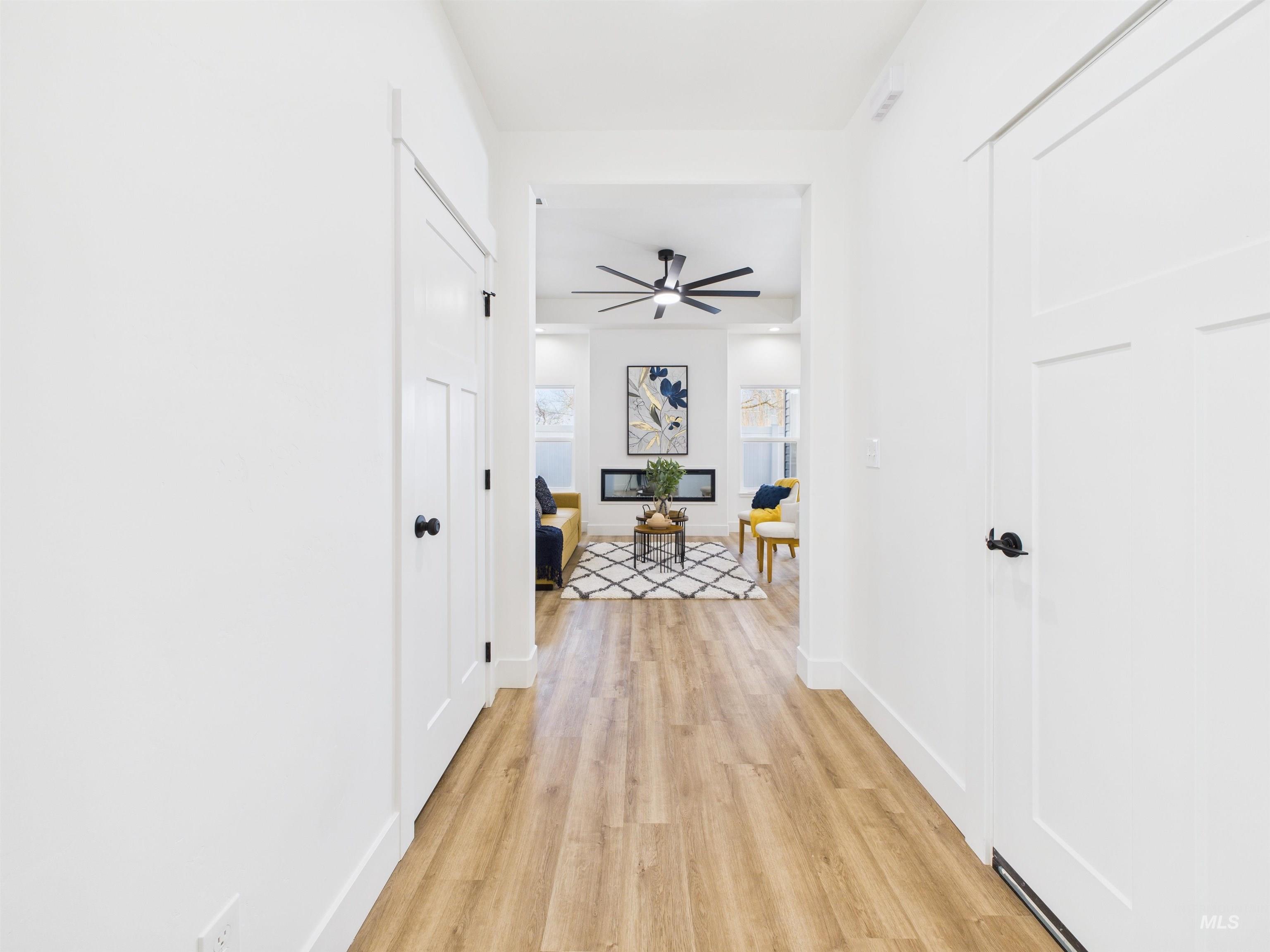 1216 Bronze Drive Rupert, ID 83350 - Photo 3 of 28 Hallway with light wood-style flooring and baseboards