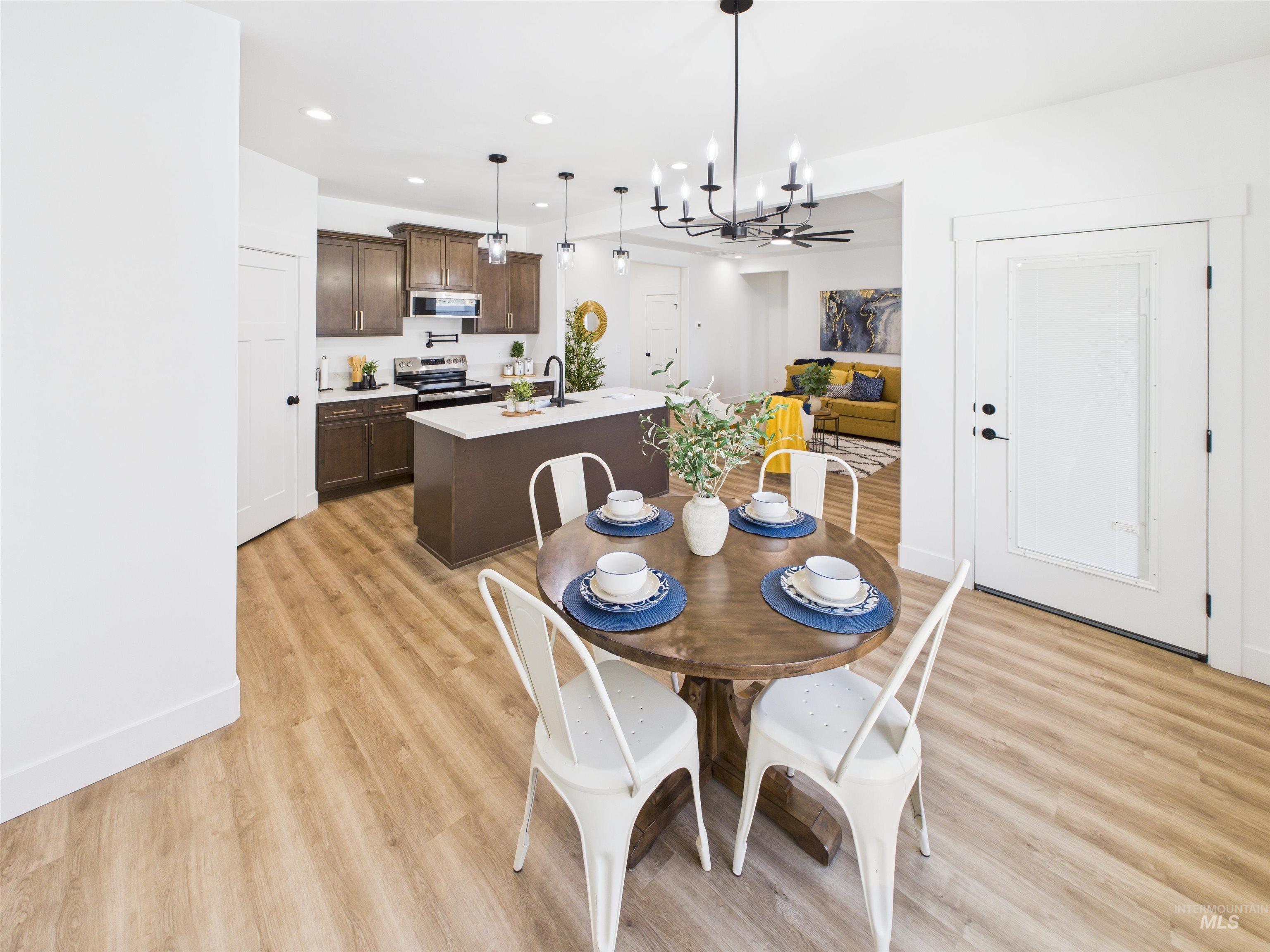 1216 Bronze Drive Rupert, ID 83350 - Photo 10 of 28 Dining room featuring a chandelier, recessed lighting, and light wood-type flooring
