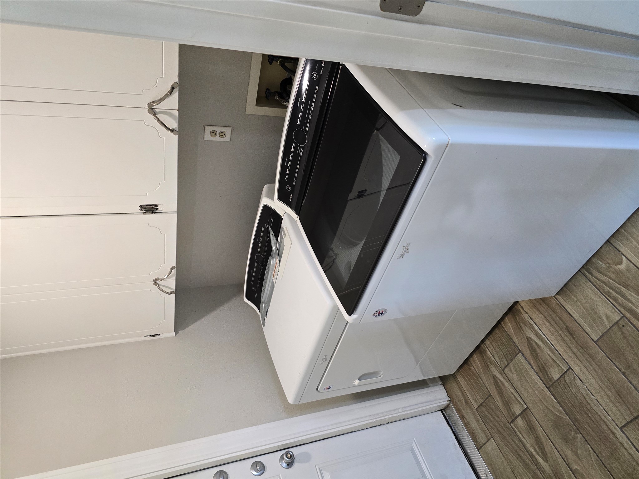 205 East Cherokee Drive Harker Heights, TX 76548 - Photo 10 of 23 Functional laundry space featuring modern appliances and convenient overhead storage.