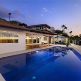 a front view of a house with swimming pool