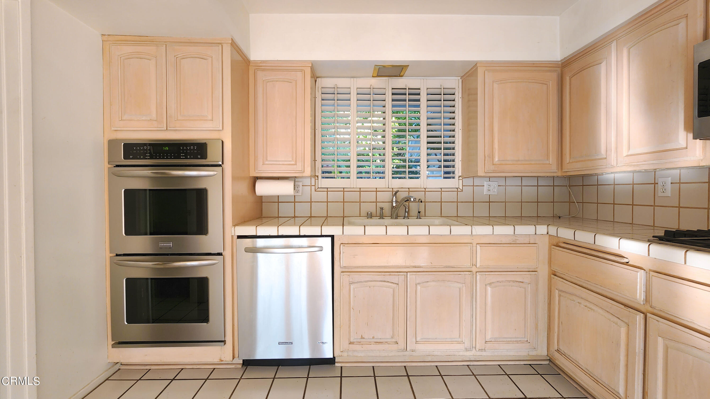 1980 Crestshire Drive Glendale, CA 91208 - Photo 13 of 27 a kitchen with white cabinets and a stove top oven