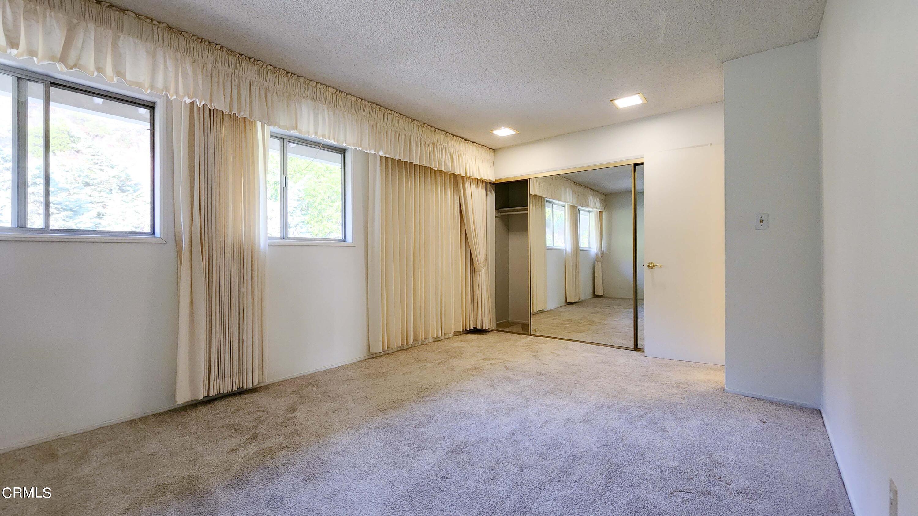 1980 Crestshire Drive Glendale, CA 91208 - Photo 17 of 27 an empty room with windows and closet