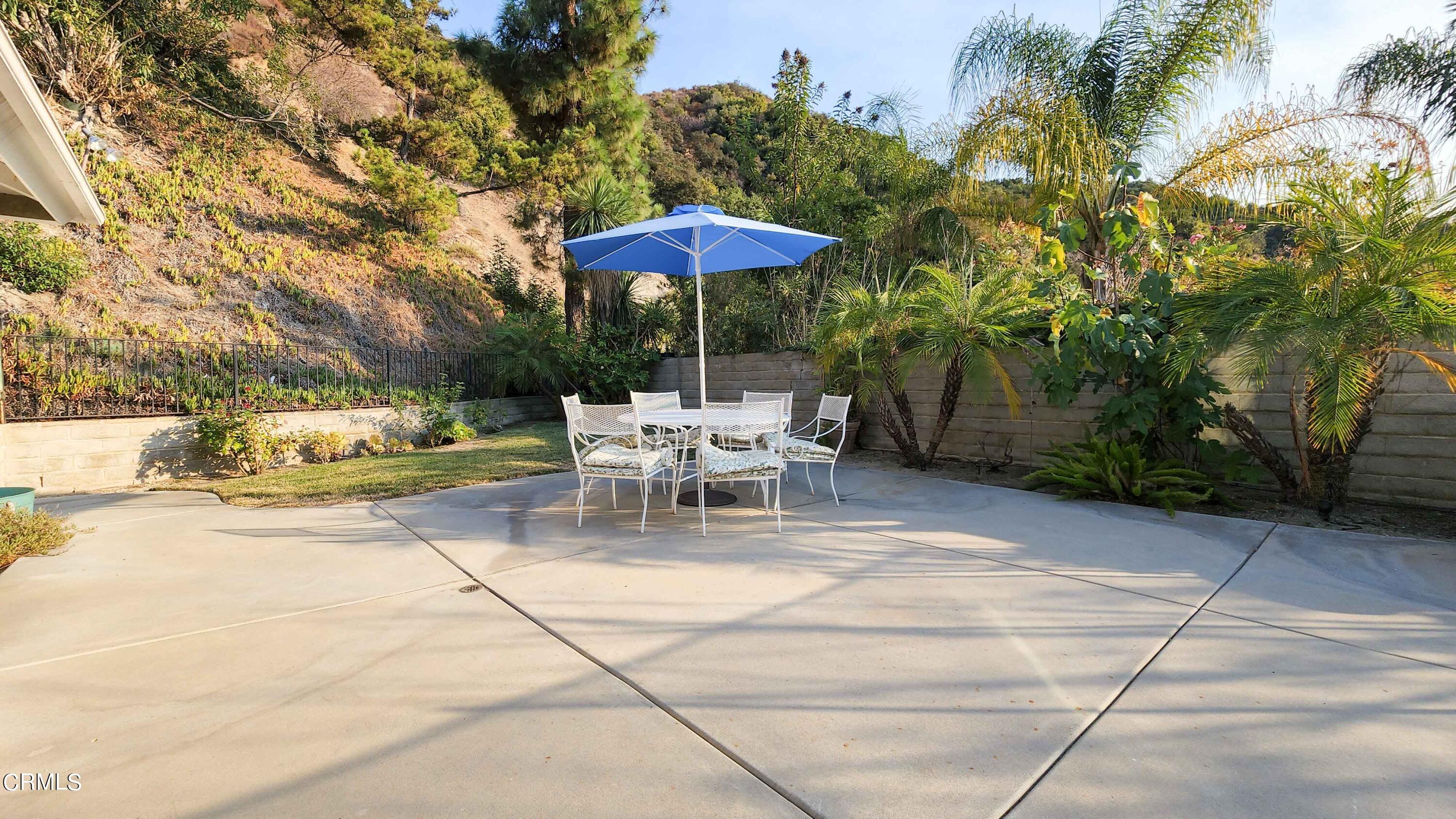 1980 Crestshire Drive Glendale, CA 91208 - Photo 21 of 27 a white bath tub sitting under a blue umbrella