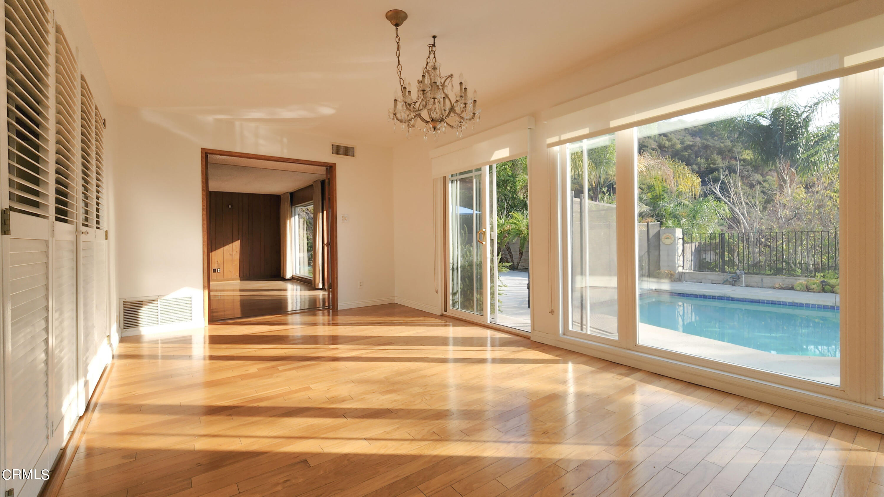 1980 Crestshire Drive Glendale, CA 91208 - Photo 8 of 27 a view of a living room with a large window and chandelier