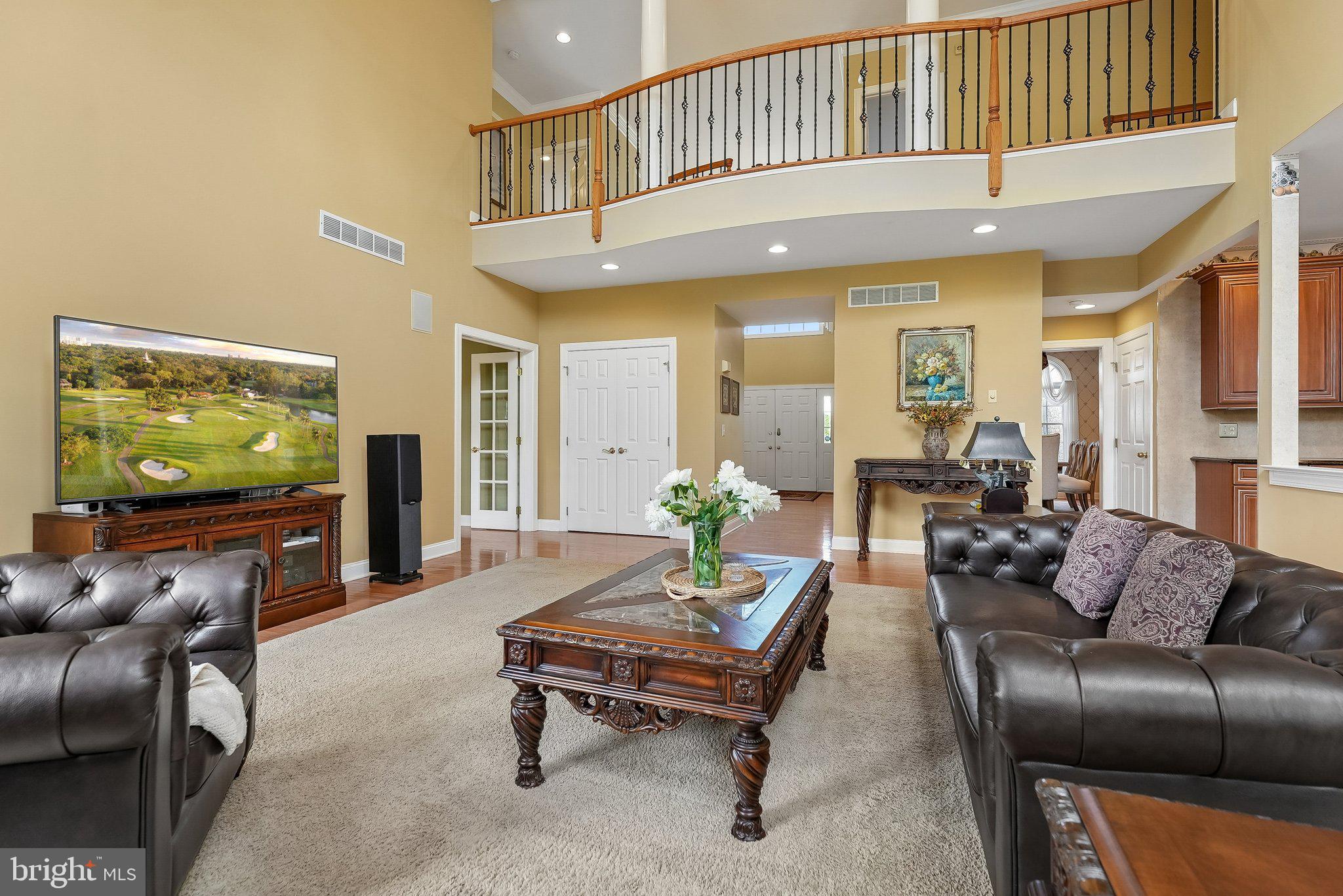 1 Baker Way Pennington, NJ 08534 - Photo 7 of 77 a living room with furniture and a flat screen tv