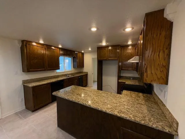 a view of outdoor space with wooden floor and windows