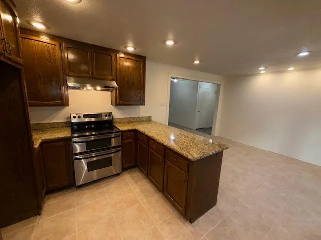 a view of an empty room and a window