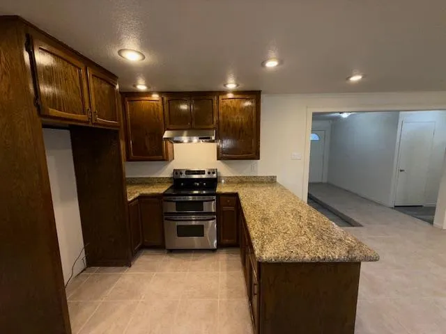 a bathroom with a sink a mirror and a toilet