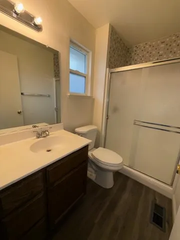 a view of an entryway with wooden floor and windows