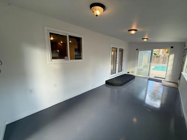 a utility room with cabinets washer and dryer
