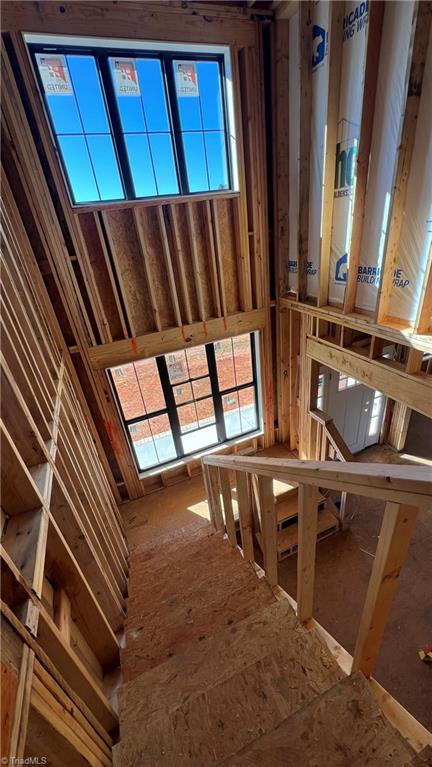 6205 Phillippi Road Julian, NC 27283 - Photo 11 of 33 Dual level stairway with vaulted ceiling & large windows