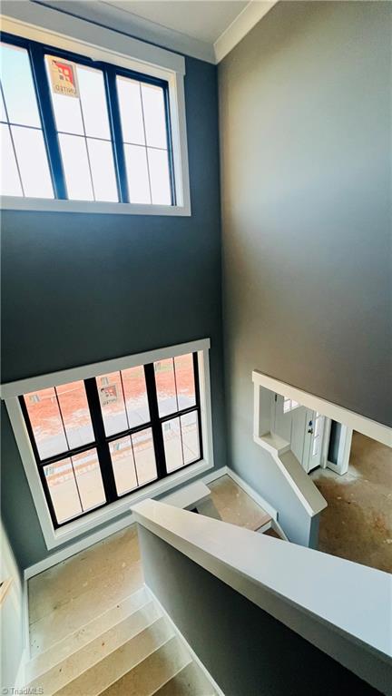 6205 Phillippi Road Julian, NC 27283 - Photo 16 of 35 Open staircase with platform landing and large windows