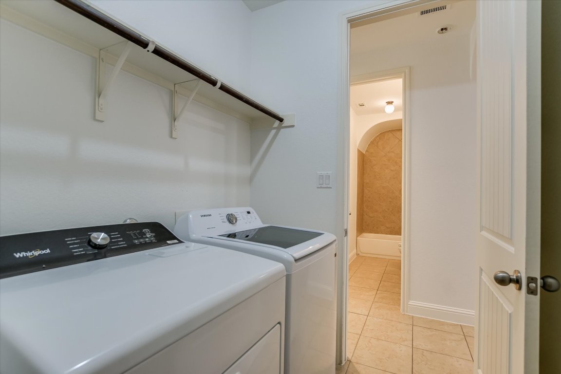 3104 Herradura Drive Cedar Park, TX 78641 - Photo 11 of 20 a utility room with dryer and washer