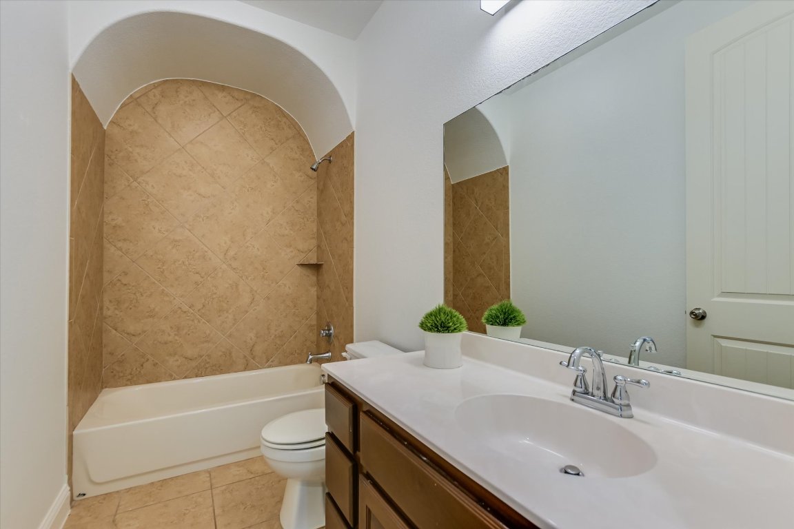 3104 Herradura Drive Cedar Park, TX 78641 - Photo 16 of 20 a bathroom with a sink a toilet and shower