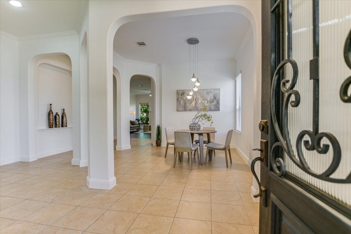 3104 Herradura Drive Cedar Park, TX 78641 - Photo 4 of 20 a view of a dining room with furniture and chandelier
