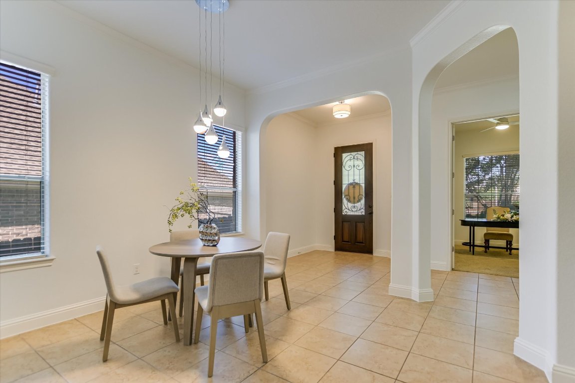 3104 Herradura Drive Cedar Park, TX 78641 - Photo 7 of 20 a view of a dining room with furniture and wooden floor