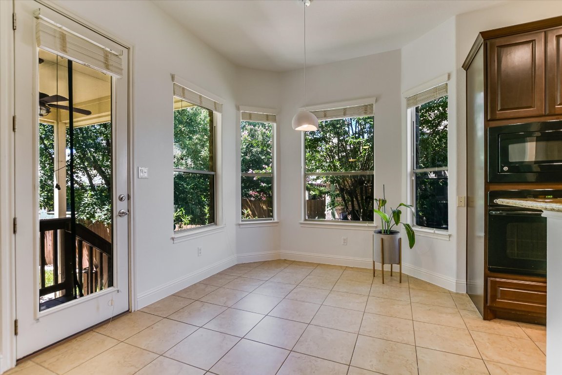 3104 Herradura Drive Cedar Park, TX 78641 - Photo 10 of 20 a view of an empty room with a fireplace and a window