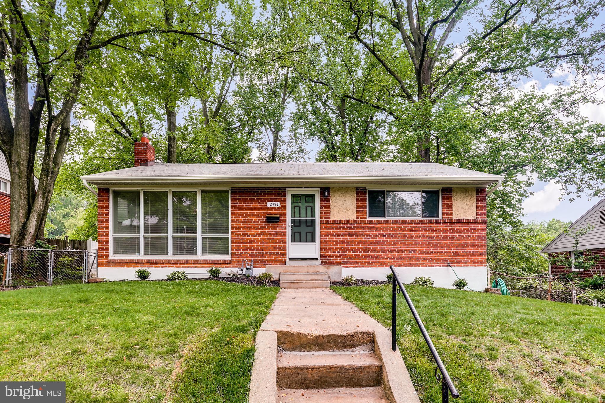12714 Helen Road Silver Spring, MD 20906 - Photo 1 of 19 front view of a house with a yard