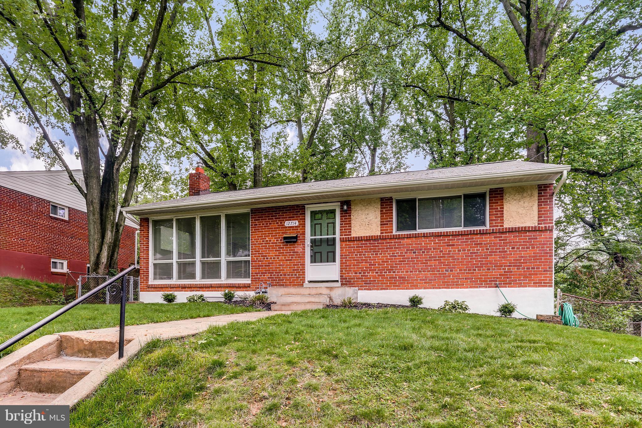 12714 Helen Road Silver Spring, MD 20906 - Photo 2 of 19 a front view of a house with garden