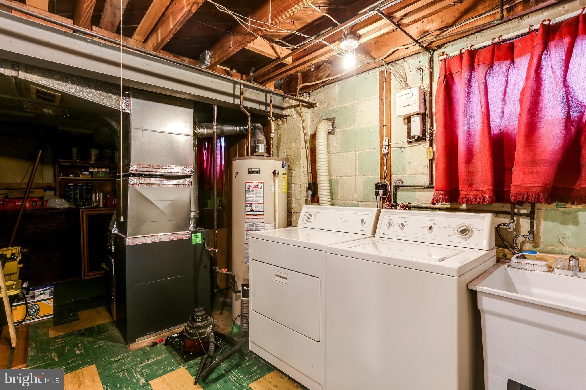 12714 Helen Road Silver Spring, MD 20906 - Photo 15 of 19 a utility room with dryer and washer
