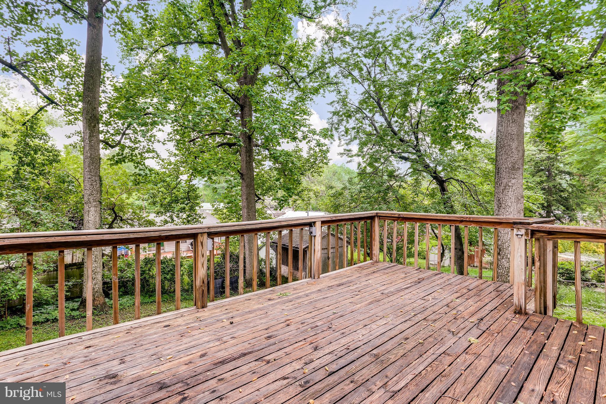 12714 Helen Road Silver Spring, MD 20906 - Photo 17 of 19 a balcony with wooden floor and fence