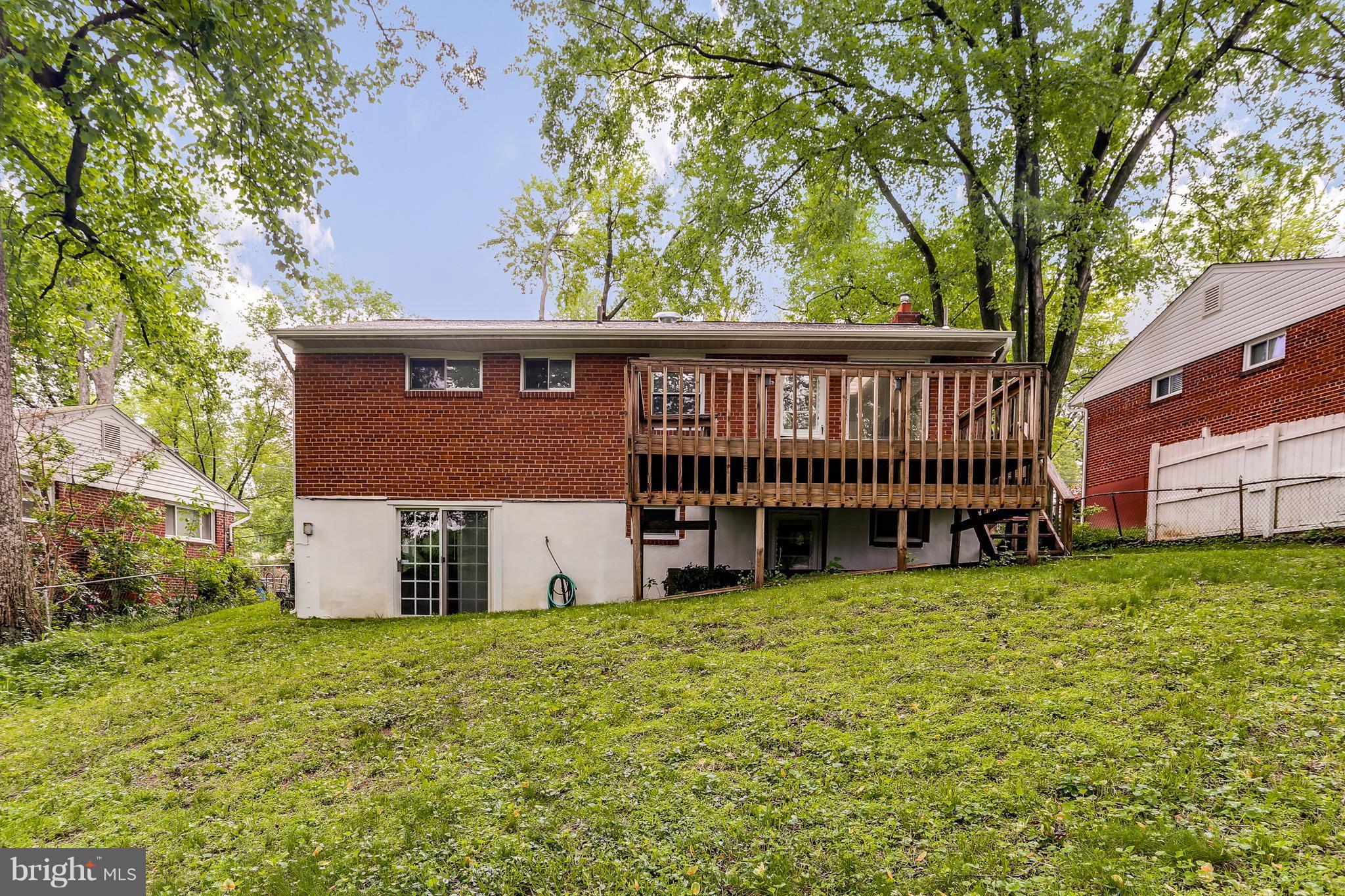 12714 Helen Road Silver Spring, MD 20906 - Photo 18 of 19 a view of a house with a yard and sitting area