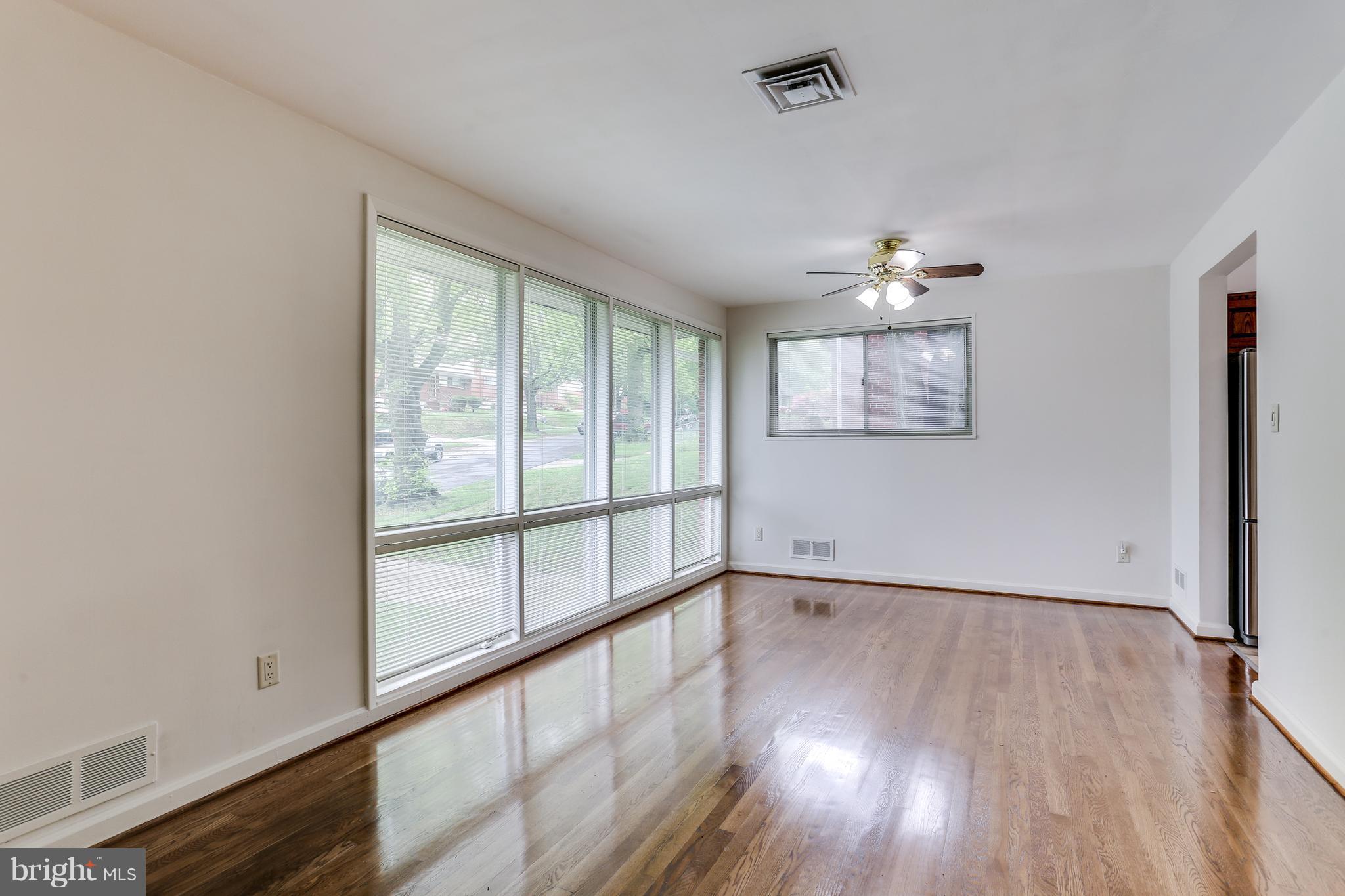 12714 Helen Road Silver Spring, MD 20906 - Photo 3 of 19 wooden floor in an empty room with a window