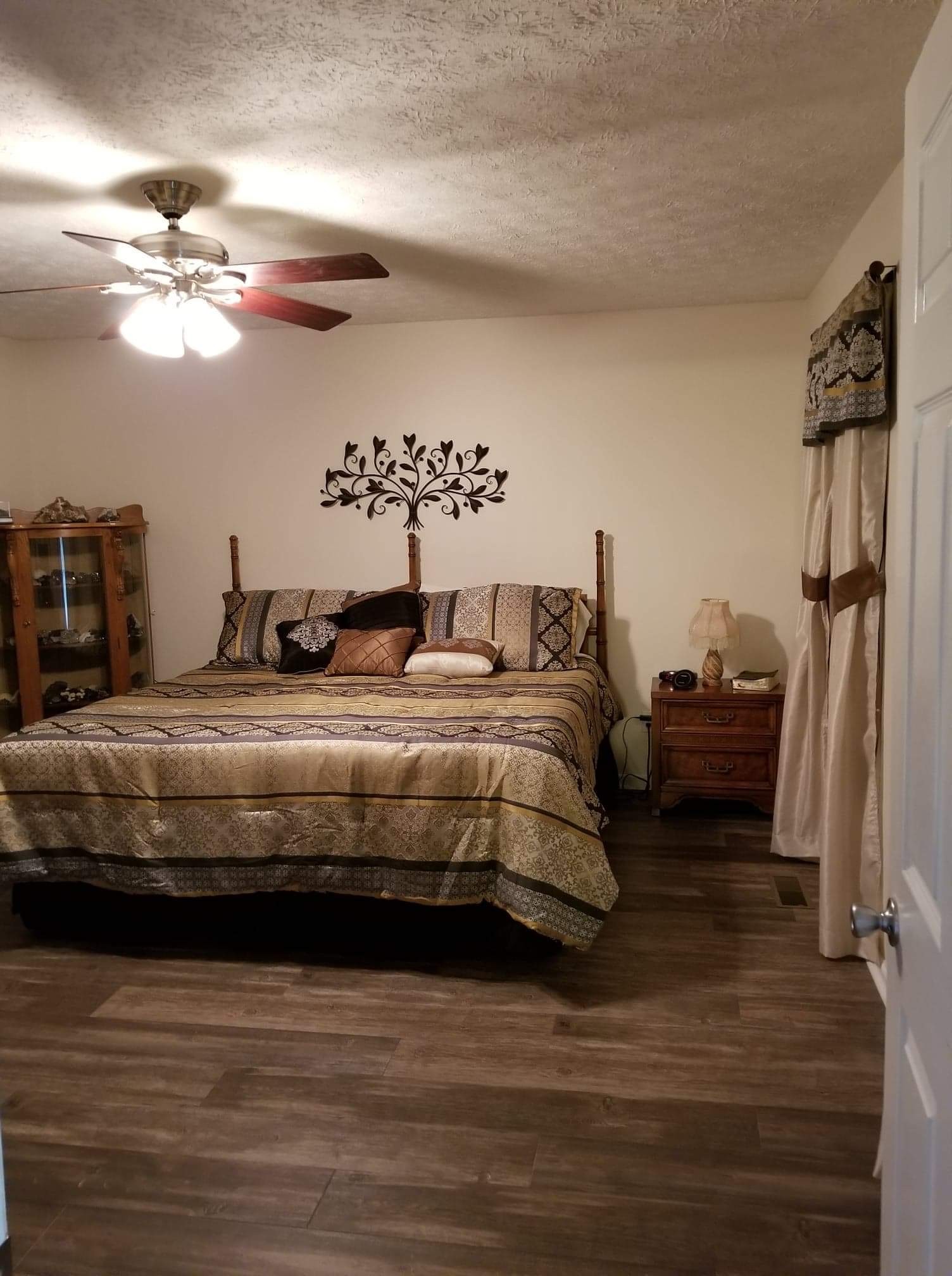 1497 Union Camp Road Lafayette, TN 37083 - Photo 14 of 19 a bedroom with a bed and a chandelier