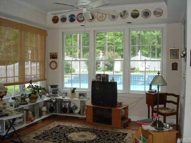 2332 Primrose Valley Court Raleigh, NC 27613 - Photo 11 of 12 A lovely basement nook area, surrounded by windows, provides a great view of the pool and back yard.
