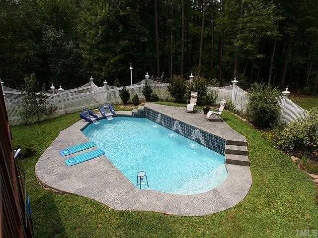 2332 Primrose Valley Court Raleigh, NC 27613 - Photo 12 of 12 A beautiful in-ground pool with waterfalls is enclosed by a custom-designed fence and provides great opportunities for relaxing or entertaining.