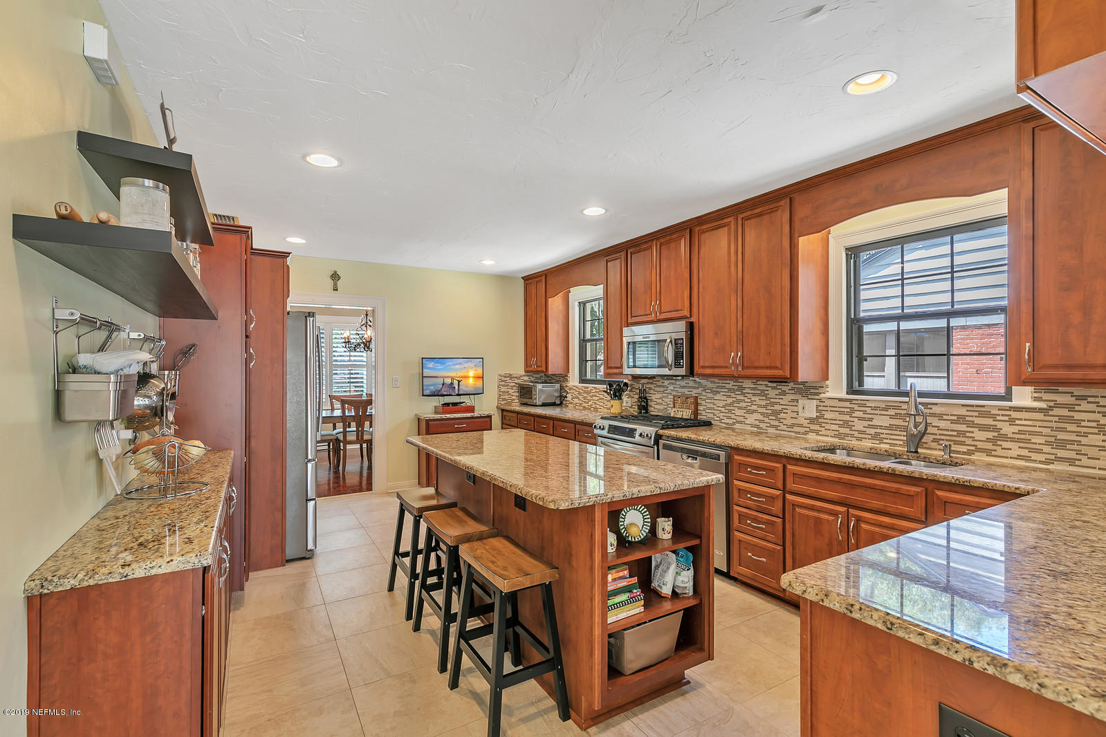 1425 Nicholson Road Jacksonville, FL 32207 - Photo 12 of 45 a kitchen with granite countertop a sink and cabinets