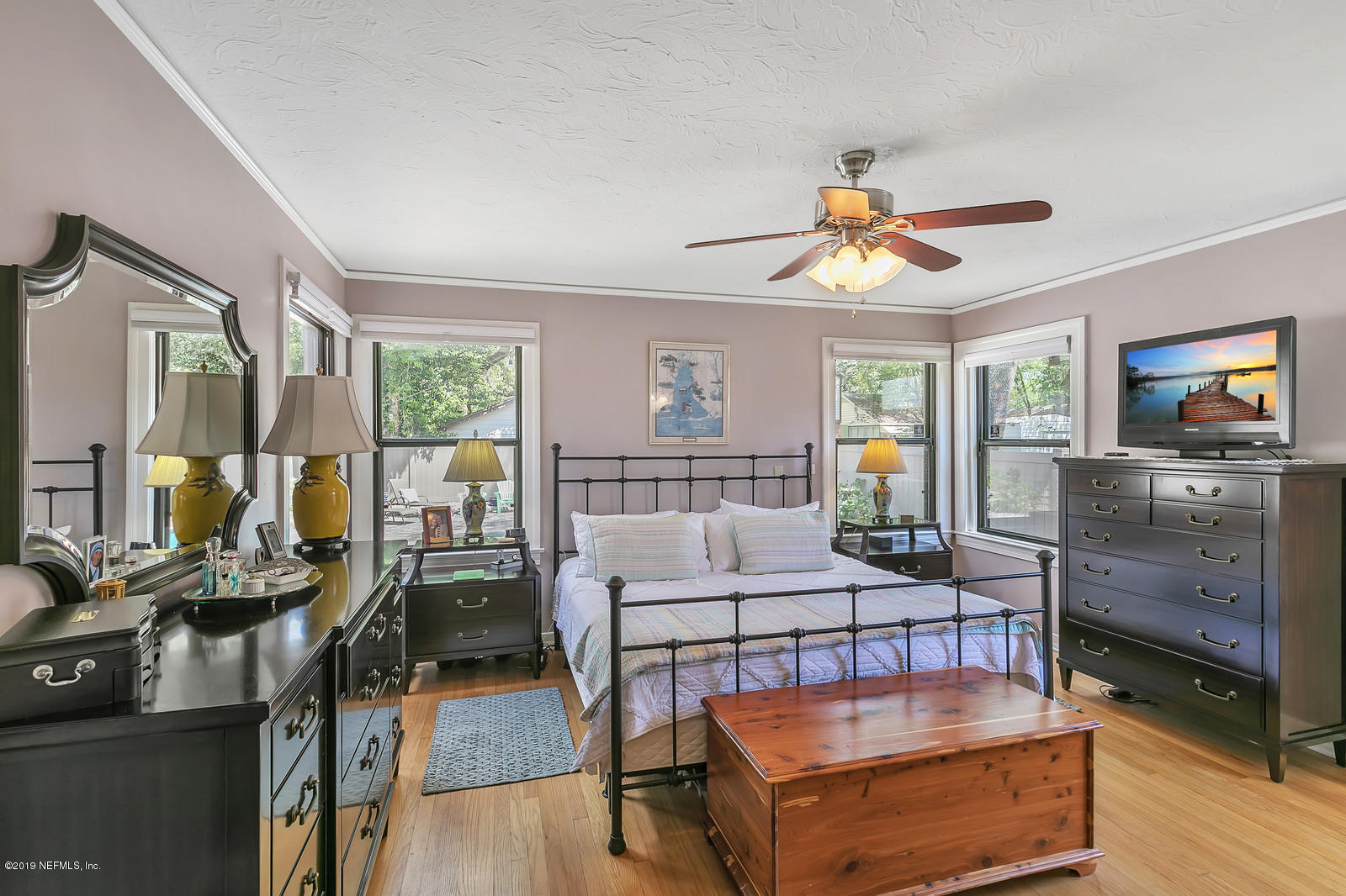 1425 Nicholson Road Jacksonville, FL 32207 - Photo 20 of 45 a living room with furniture a flat screen tv and a table