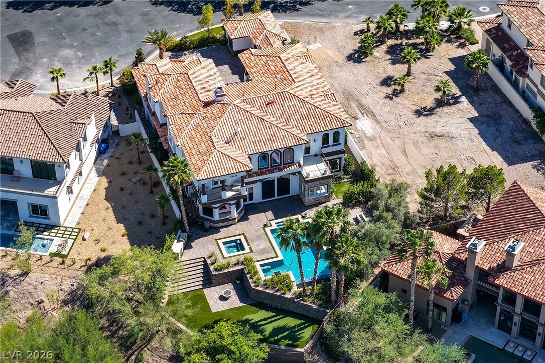 6 Rue Du Ville Henderson, NV 89011 - Photo 91 of 99 An aerial perspective reveals a sprawling estate with elegant tile roofing and a refreshing pool.
